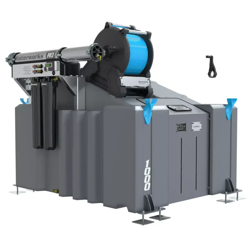 A large grey and blue 1 Man 1000L Water Fed Pole System (RO) with Manual Reel, a van-mounted pure water window cleaning machine, features a blue hose reel, control panel, sturdy base, and has a black handheld tool nearby.